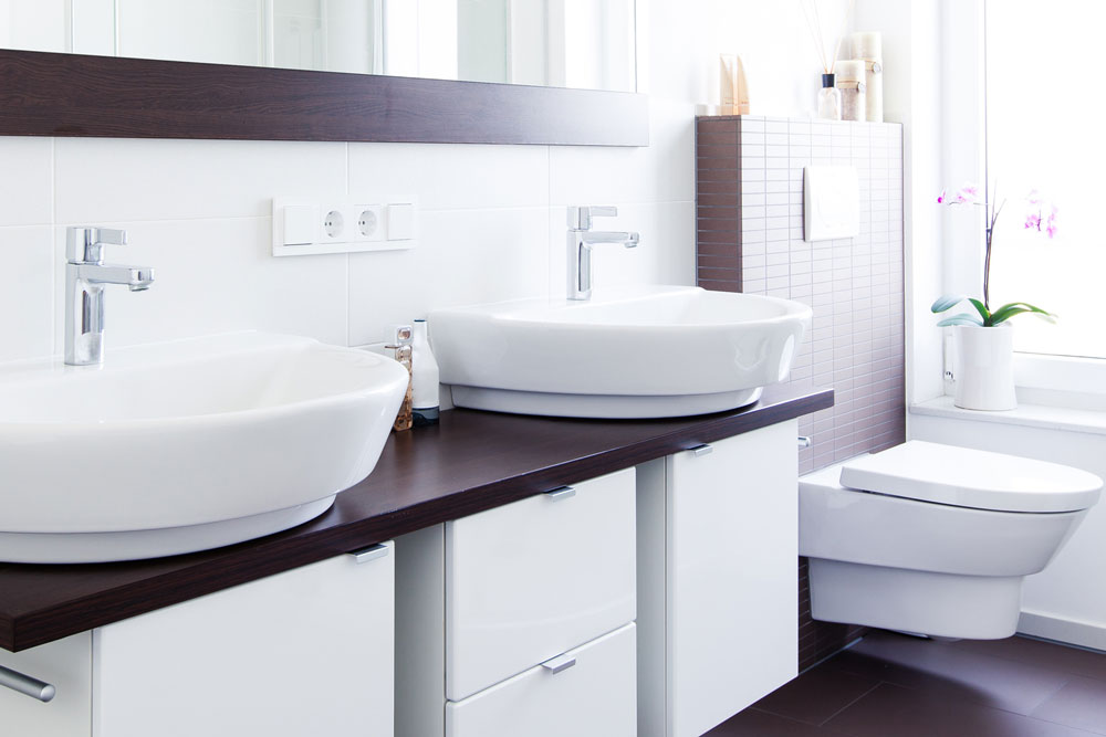 High End Bathroom with double sinks and wall mount toilet - Harris Plumbing Inc.